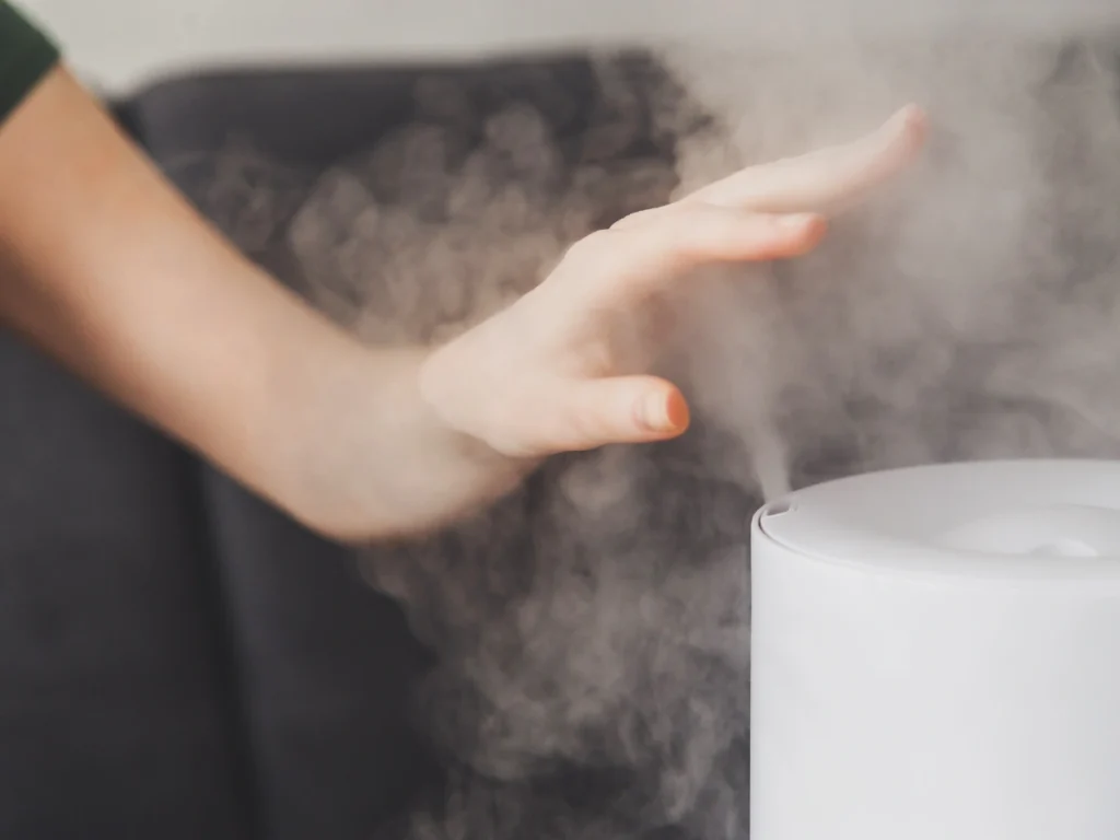 Warm mist indoor humidifier releases warm, soothing vapor into the air